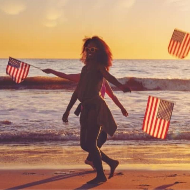 People on the Beach with American Flags